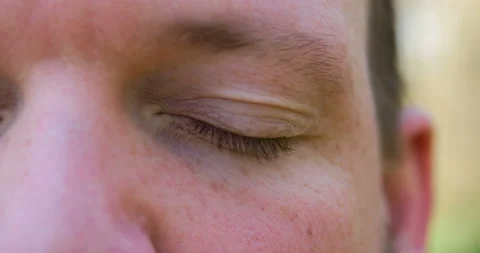 Attractive man eye opening. Close up of man blue eye. clear and detailed shot. Stock Footage 103808702