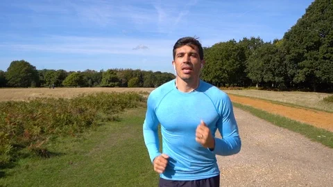 Attractive Man Jogging in Slow Motion Stock Footage 96046693