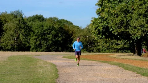 Attractive Man Jogging Towards Camera 4K Stock Footage 96047872