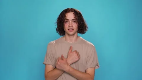 Attractive Man Looking To Camera And Showing With Deaf-Mute Sign I love Life Stock Footage 157892339