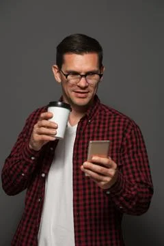 Attractive man posing on dark background Stock Photos