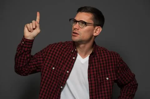 Attractive man posing on dark background Stock Photos