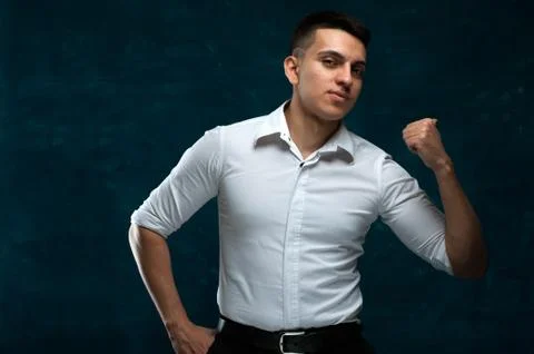 Attractive man posing on dark background Stock Photos