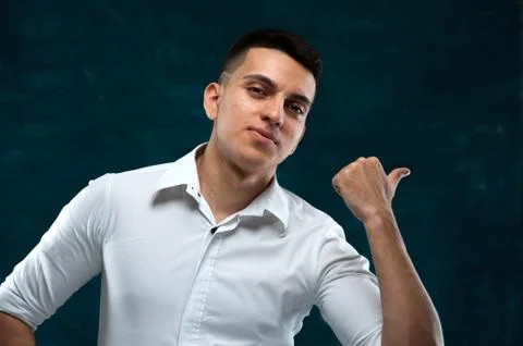 Attractive man posing on dark background Stock Photos