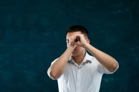 Attractive man posing on dark background Stock Photos