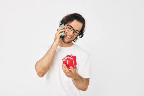 Attractive man Red gift box telephone communication isolated background Stock Photos