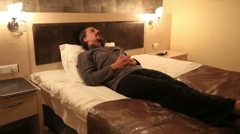 Attractive man resting on the bed  Video stock 33548054