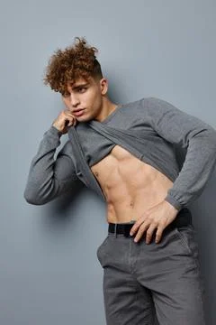 Attractive man sexy posing self confidence isolated background Fotos Stock