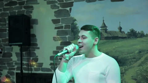 Attractive man singing song Stock Footage 59746681
