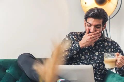 Attractive man taking a break from working at home remote job concept medium Stock Photos