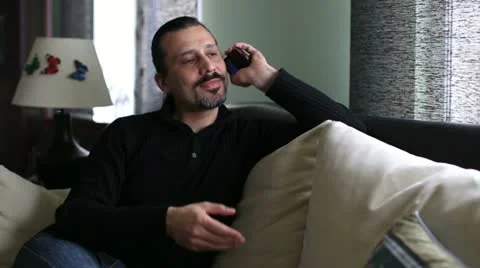 Attractive man talking cell phone Video stock 22154300