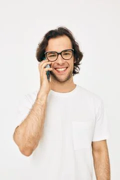 Attractive man talking on the phone technologies Lifestyle unaltered Stock Photos