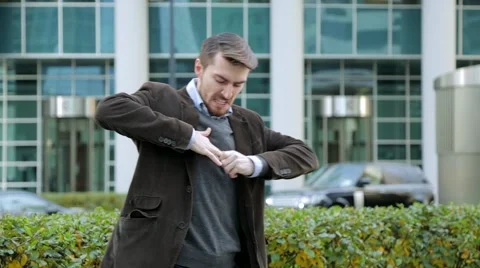 Attractive man trying to take off a ring from his finger Vidéo 68402120