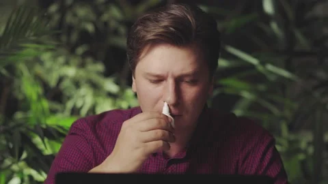 Attractive man using a cold spray Stock Footage 150151687