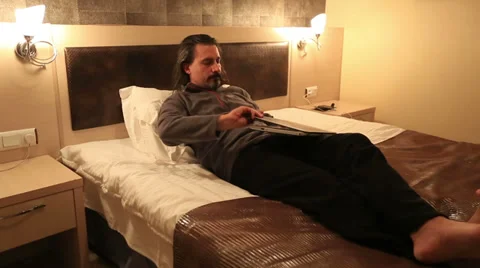 Attractive man using laptop Stock Footage 33548098