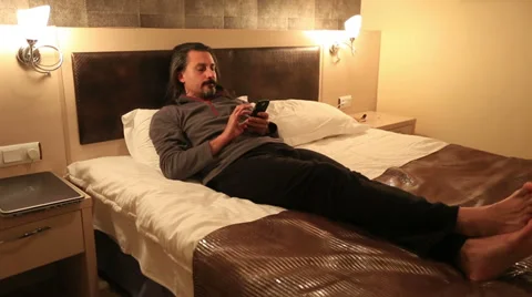 Attractive man using smart phone Stock Footage 33548037