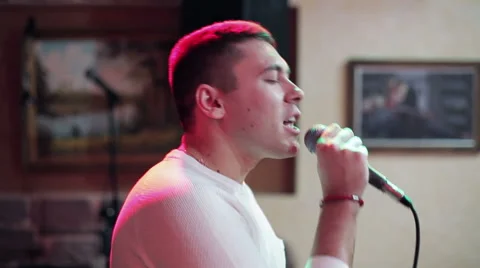 Attractive man very emotional singing Stock Footage 59746765