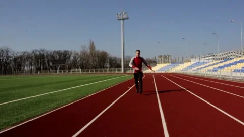 Attractive man walking doing squat warming up stretching workout in slow motion Stock Footage 137542702