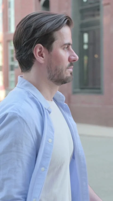 Attractive Man Walking in Street, Side Pose, Vertical Video 스톡 동영상 339664915