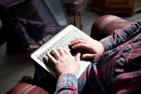 Attractive man working on computer. Stock Photos