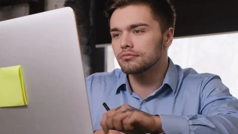 Attractive man working out of office Stock Footage 104136347
