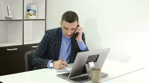 Attractive manager in checkered jacket talking on mobile phone. Stock Footage 66573974