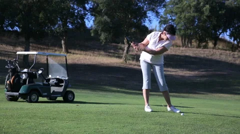 Attractive Mature woman plays Golf at the country club. Stock Footage