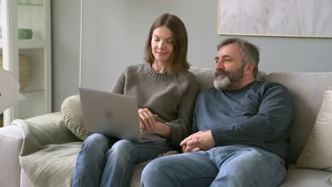 Attractive Middle Age Man with His Daughter. Caucasian Woman Explain To Father Stock Footage 153806465