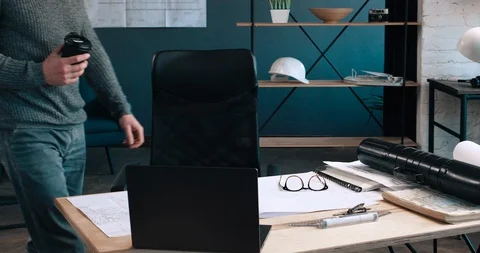 Attractive middle aged Man sitting at his Workplace and Starts. Stock Footage 126242969