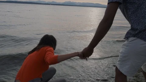 Attractive middle eastern couple playing splashing in the ocean Video stock 111976963