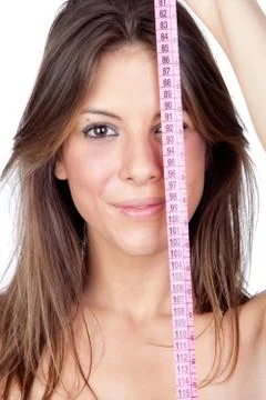 Attractive model girl with a tape-measure Stock Photos