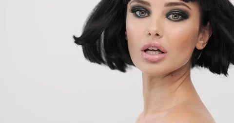 Attractive model turns and looking. Young woman with smokey eyes makeup.  Clo Stock Footage 117191625