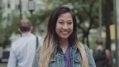 Attractive nurse smiling in city Stock Footage 130282913