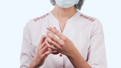 Attractive nurse in a white coat preparing an injection in a hospital. A nurse Stock-Footage 58628151
