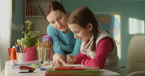 Attractive Parent Mother Helping to Do Homework to Little Student School Girl Video stock 101544322