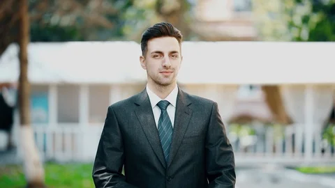 Attractive pensive young man thinking with his hand on a chin. Stock Footage 95222000