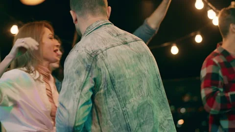 Attractive people have fun time together at the party they dancing drinking Video stock 158814930