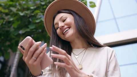 Attractive portrait of laughing splendid young woman with long hair and stylish Stock Footage 120184486