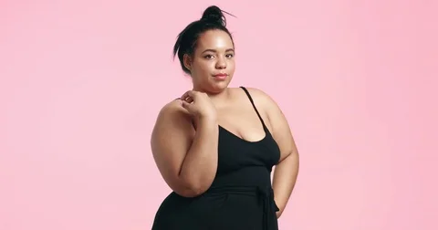 Attractive positive big model in one piece suit Stock Footage 81348251