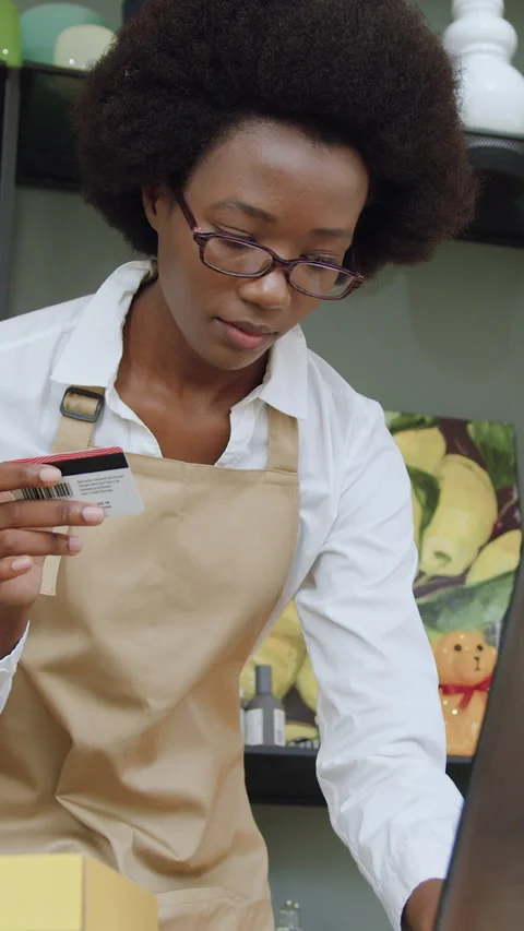 Attractive positive hardworking 25-aged female african american seller in glasse Stock Footage 325206267