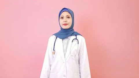 Attractive pretty muslim female medical doctor Stock Footage