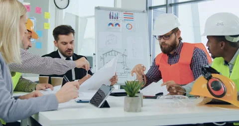 Attractive professional skilled multiracial engineers and their attantive Stock Footage 145600896