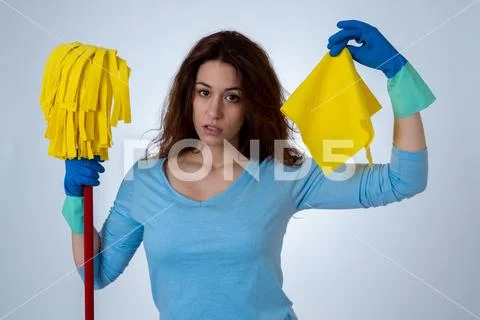 Attractive red haired woman bored and restless of cleaning and housekeeping Stock Photos