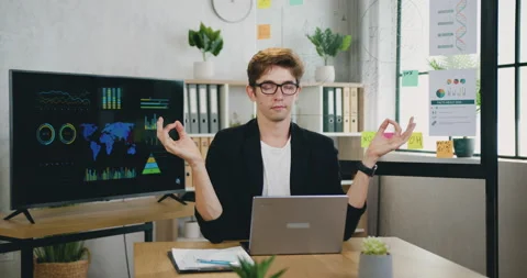 Attractive relaxed successful creative young male office manager meditating at 스톡 동영상 162734051