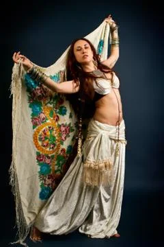 Attractive retro model in old-fashioned wild clothing dancing Stock Photos
