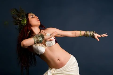 Attractive retro model in old-fashioned wild clothing dancing Stock Photos