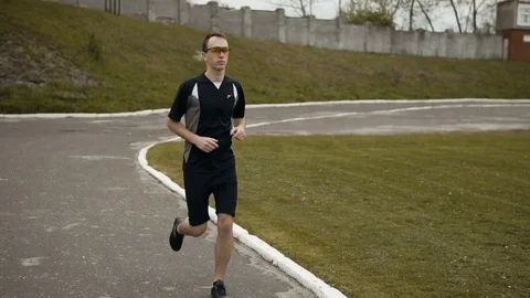 Attractive Runner in Yellow Sunglasses 動画素材 75721218