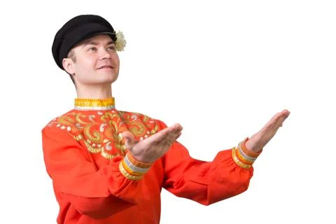 Attractive russian guy dancing in folk costume Stock Photos