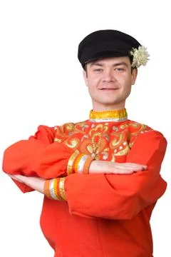 Attractive russian guy dancing in folk costume Stock Photos