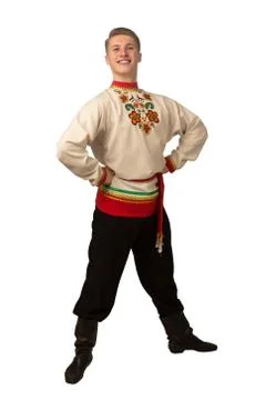 Attractive russian guy dancing in folk costume isolated on white Stock Photos